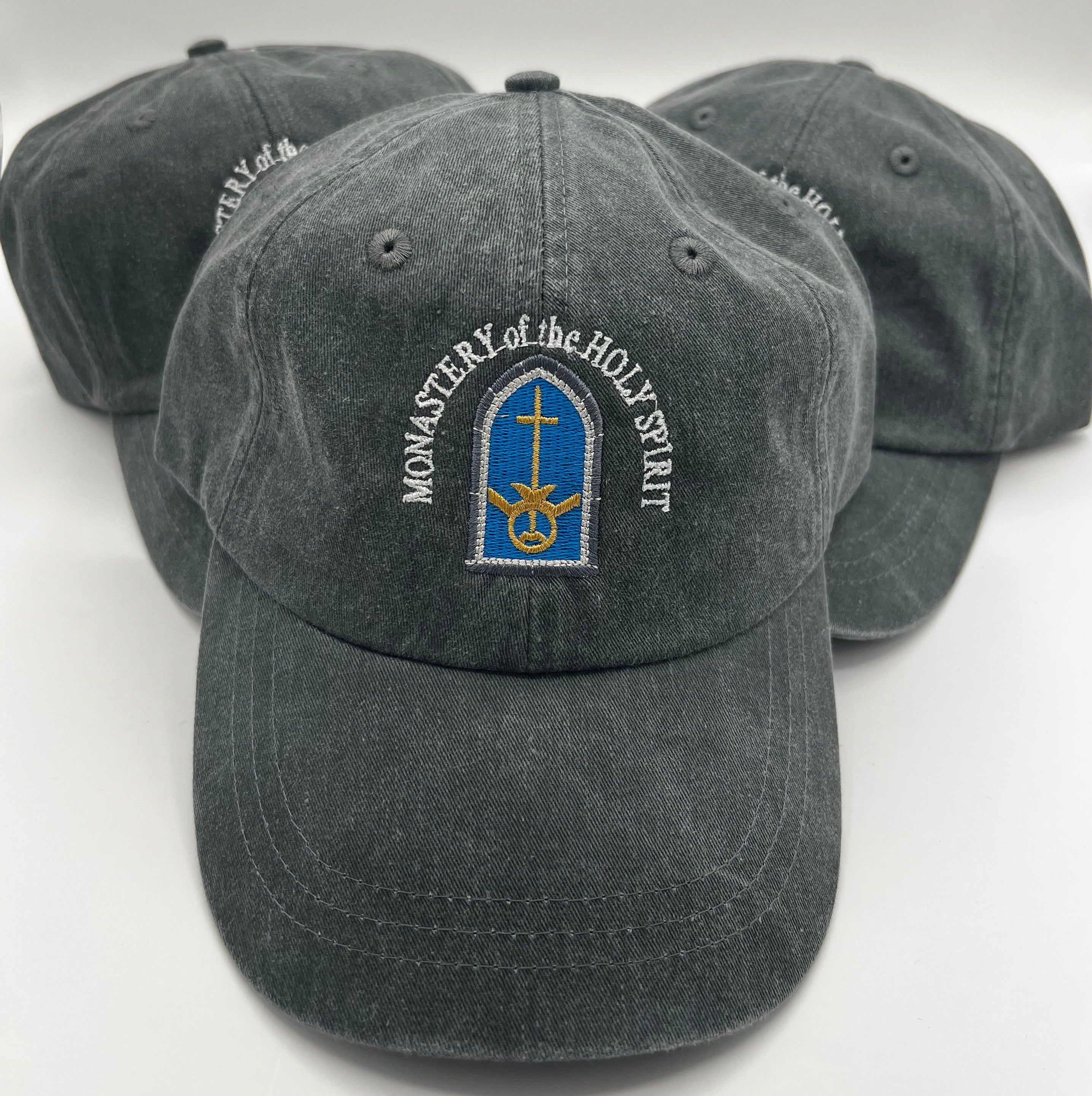 Monastery Embroidered Cap/Hat
Adams brand
Optimum Pigment-Dyed Cap includes these features:

Color: Charcoal
•	100% garment-washed cotton twill
•	6 panel, unstructured, low-profile
•	Cool-Crown™ mesh lining
•	Multiple rows of stitching on bill
•	Multiple rows of stitching on self-fabric sweatband
•	Tuck-away leather back strap with antiqued brass buckle and grommet